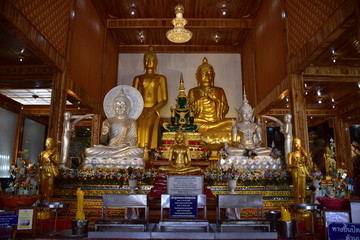 Golden statue of buddha in temple, Thailand	