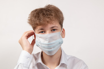 Portrait of young boy in protective medical mask