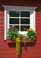 Fototapeta na wymiar Scandinavian window with flower box.