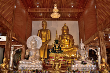 Fototapeta premium Golden statue of buddha in temple, Thailand 