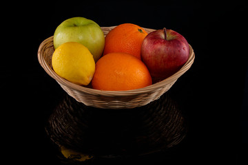 apple orange lemon fruits in basket