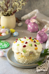 Holiday salad is not a sweet cake. Salad with rice, egg, crab sticks and cucumber on a stone or concrete on a light countertop.