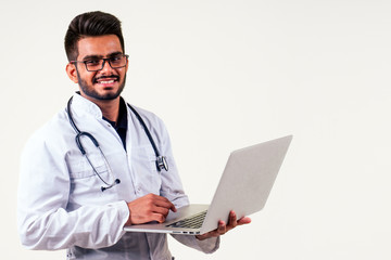 Portrait of indian male doctor checking medicine white isolate studio background.remote freelancing concept