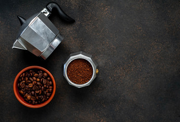 Geyser Coffee Maker and beans on a stone background. Top view with copy space for your text.