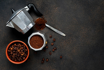 Geyser Coffee Maker and beans on a stone background. Top view with copy space for your text.
