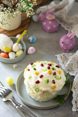 Holiday salad is not a sweet cake. Salad with rice, egg, crab sticks and cucumber on a stone or concrete on a light countertop. Copy space.