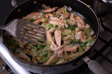 Cooking a chicken curry while stuck at home.