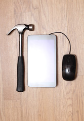 Work tools and modern smartphone on a wooden board. Homework Image