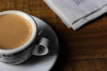 cup  of espresso on a wooden table