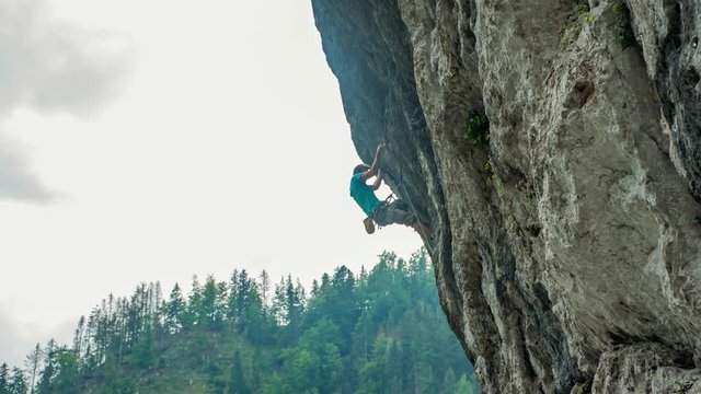 Solo Free Climber Scrambling Up Natural Rock Formation. Topla, Slovenia