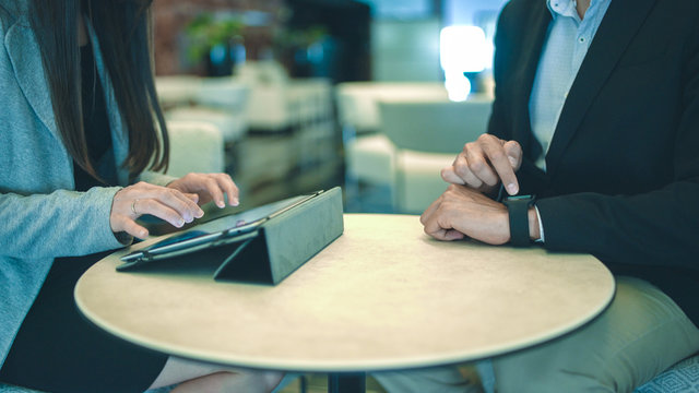 Business meeting and working with tablet and smartwatch