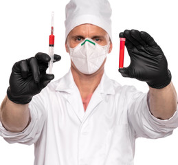 Doctor in mask and gloves holding test tube and syringe with blood over white background