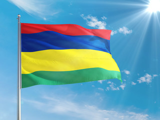 Mauritius national flag waving in the wind against deep blue sky. High quality fabric. International relations concept.