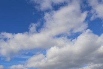Naklejka na ściany i meble Blue sky with clouds, in April 2020.
