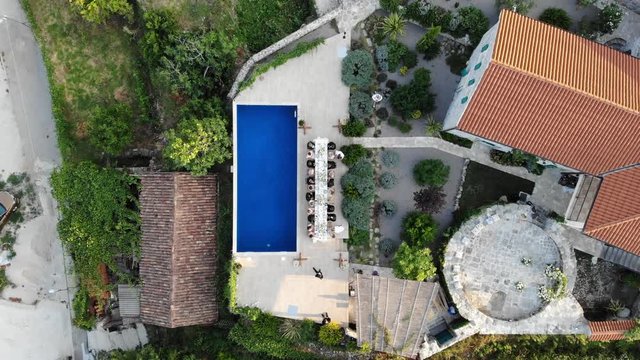 View of a villa with a swimming pool during a wedding in Montenegro with a view of the Bay of Kotor in the evening. European tourist destination