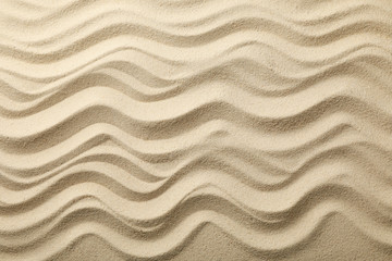 Fototapeta na wymiar Dry sea sand with waves. Background. Summer. Vacation