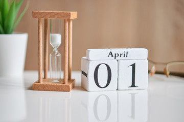 Date on white wooden cubes - the first of April 01 on a white table.