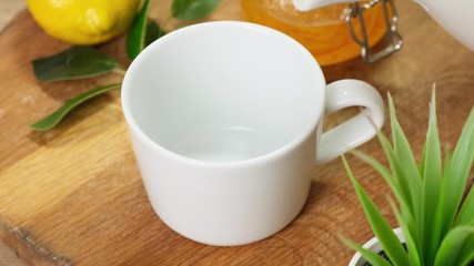 Pouring a coffee beans in white Cup. Close up.