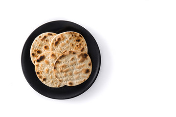 Handmade matzah for Jewish Passover isolated on white background. Top view. Copy space