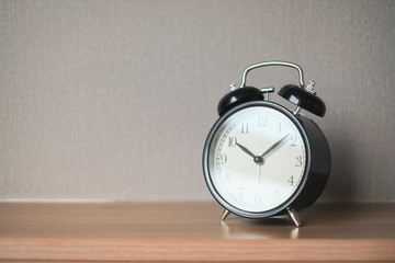 Alarm clock on grey background with copy space for you design.