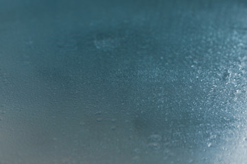 Wet mirror background with water, close up