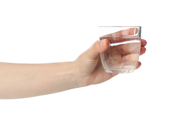 Female hand holds glass of water, isolated on white background