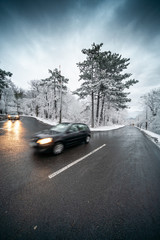 Snowy road with dramatic sky