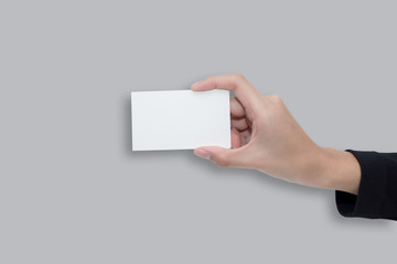 A women hand holding a white card for business on gray background with clipping path