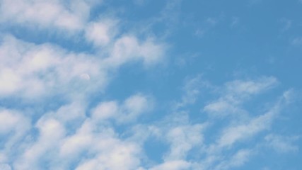 1.2.	Full moon on a bright daytime blue sky and moving clouds.