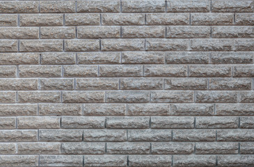 Wall decoration with gray stone. Fragment of the facade of the house. Home construction