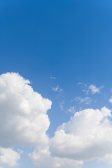 Blue background and huge clouds fluttering in the sky