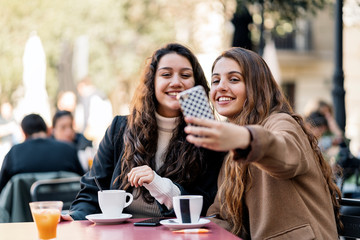 Two friends taking a selfie