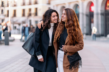 Fototapeta premium Two caucasian women walking together