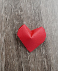 A red paper folding heart