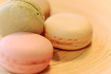 Macarons in different colours on a background
