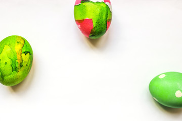 three coloured easter eggs put separatelly on white background, social distance concept, place for copy text