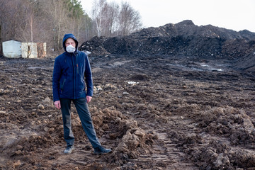 a guy stands in a mask in the middle of a post apocalyptic world