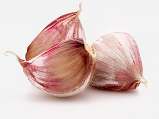 Set of red garlic cloves. Isolated on white background