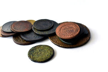 Vintage multi-colored Russian coins on a white background