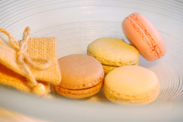 Macarons in different colours on a background