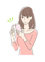 スマホを操作して笑顔の女性