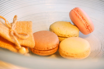 Macarons in different colours on a background