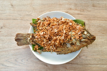 batter fried mango fish topping chop garlic dipping sweet and soy sauce 