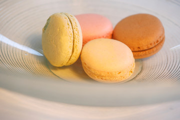 Macarons in different colours on a background