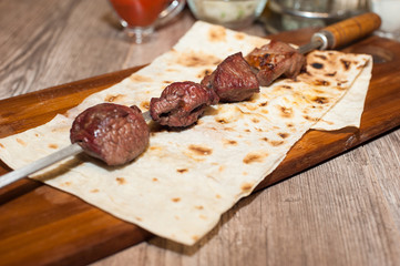 barbecue on a wooden stand