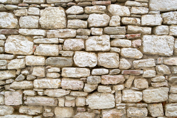 Detailed stonewall texture of a little house in a small town of Umbria in the central part of Italy