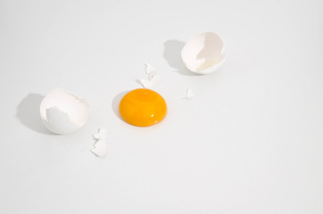 white broken egg on the table on white background