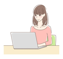 パソコンを操作して笑顔の女性