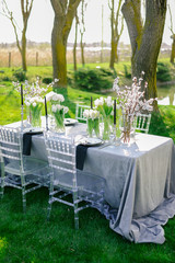 Table setting at a luxury wedding and Beautiful flowers on the table. black and white