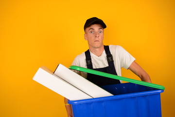 courier looking at the camera in the hands of a delivery box